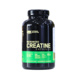 Frasco de creatina micronizada en cápsulas de Optimum Nutrition. Contiene 100 cápsulas diseñadas para apoyar el rendimiento muscular y aumentar la fuerza. Este suplemento es ideal para atletas y entusiastas del fitness que buscan mejorar su resistencia y recuperación durante el entrenamiento.