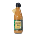 Botella de vinagre de manzana Anu, 100% natural, con etiqueta informativa y tapa negra, ideal para aderezar ensaladas y platos saludables.