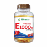 Frasco de vitamina E 1000 IU de Herbalmax, que contiene 1400 mg en 100 cápsulas blandas. Este suplemento está diseñado para proporcionar protección antioxidante diaria y contribuir a la salud cardiovascular. Fabricado en Canadá, es ideal para quienes buscan mejorar su bienestar general.